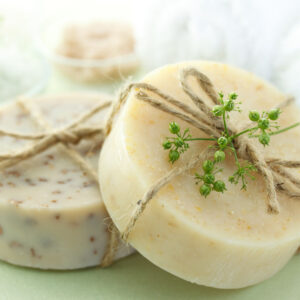 Bars of soap with bath salt and towel