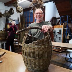 man-with-log-basket